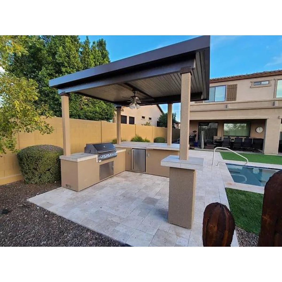 Featuring the Kokomo Aruba BBQ Island With 12' x 12' Pergola Built-In BBQ Grill.
