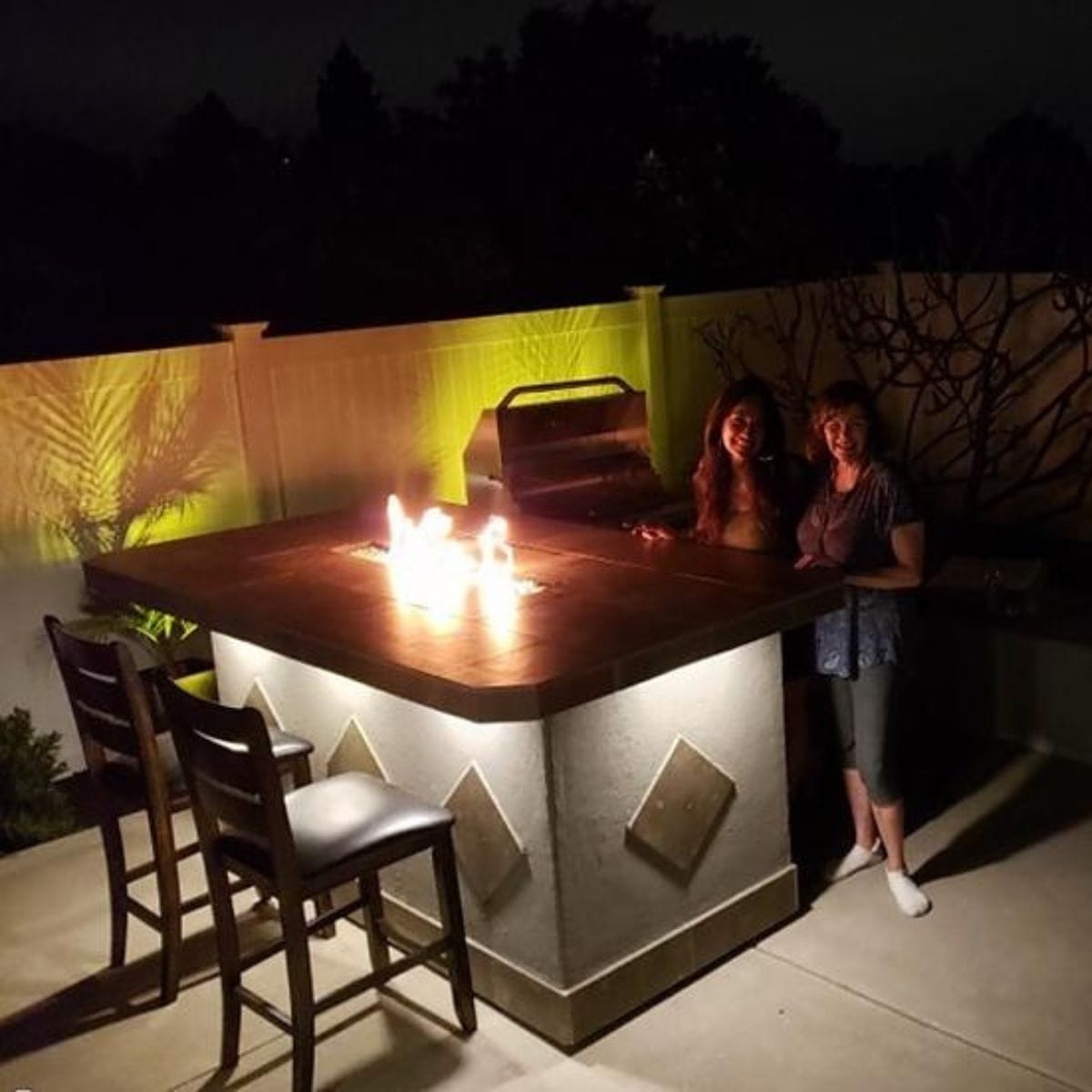 Featuring the Kokomo Baja/Fire L-Shaped BBQ Island with Fire-pit, 4 Burner BBQ, Outdoor Refrigerator