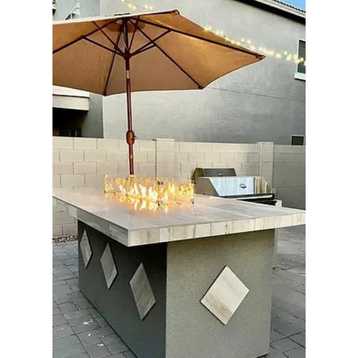 Featuring the Kokomo Baja/Fire L-Shaped BBQ Island with Fire-pit, 4 Burner BBQ, Outdoor Refrigerator