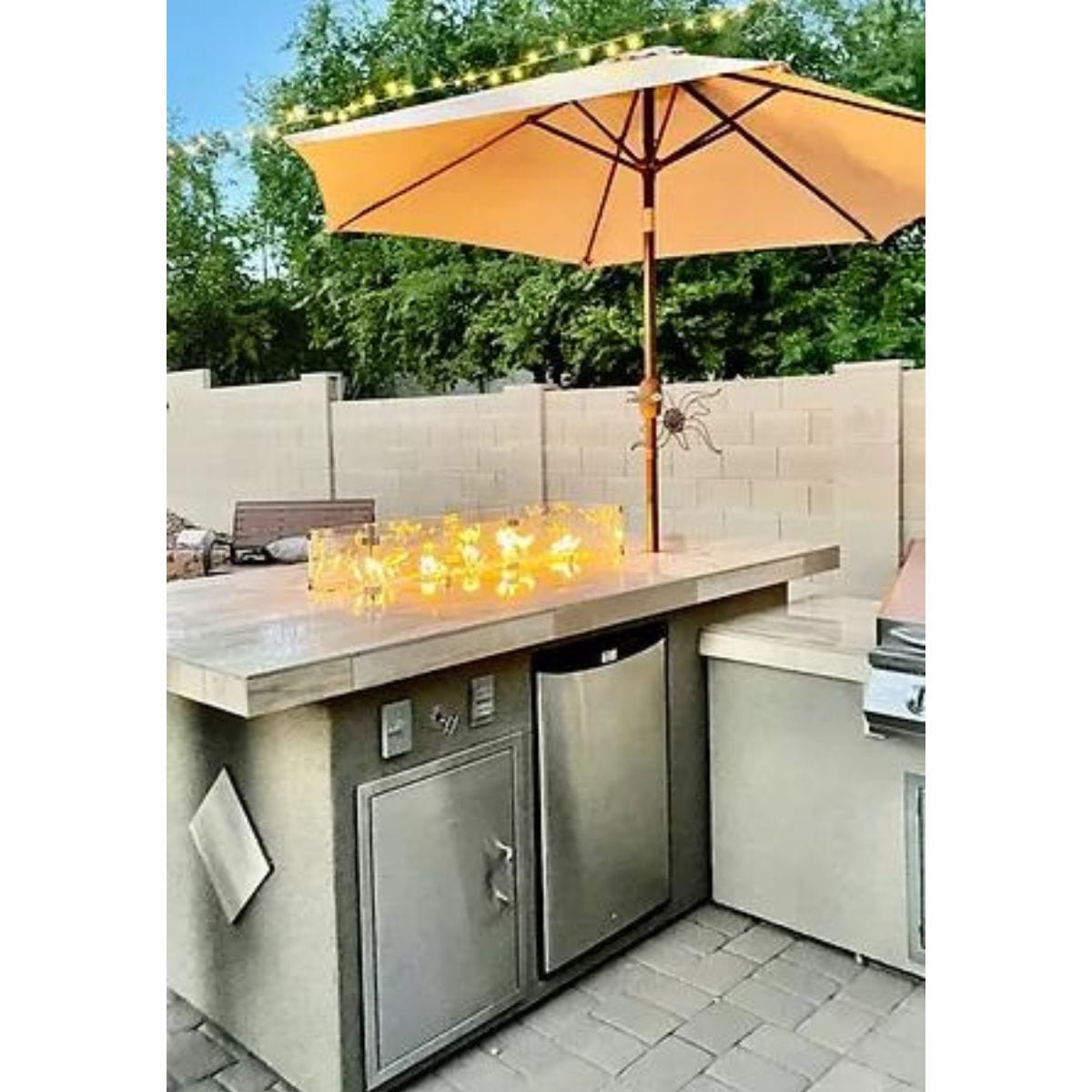 Featuring the Kokomo Baja/Fire L-Shaped BBQ Island with Fire-pit, 4 Burner BBQ, Outdoor Refrigerator