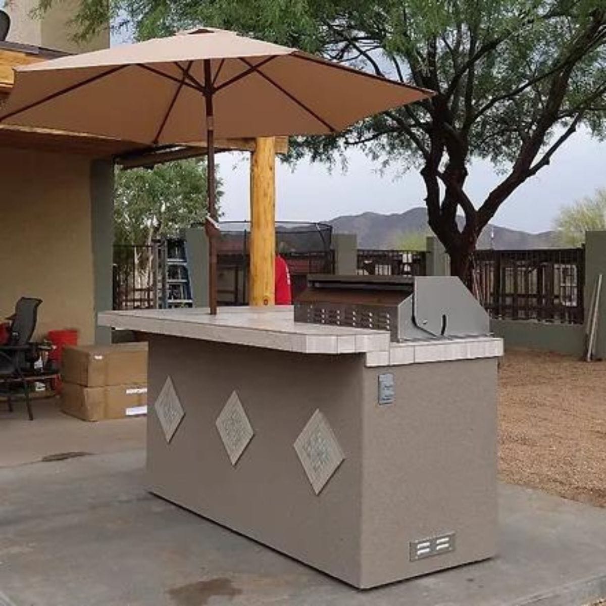 This is the finest Kokomo St. John 7'6" BBQ Island W High Bar on three sides and Lights 4 Burner BBQ Grill.