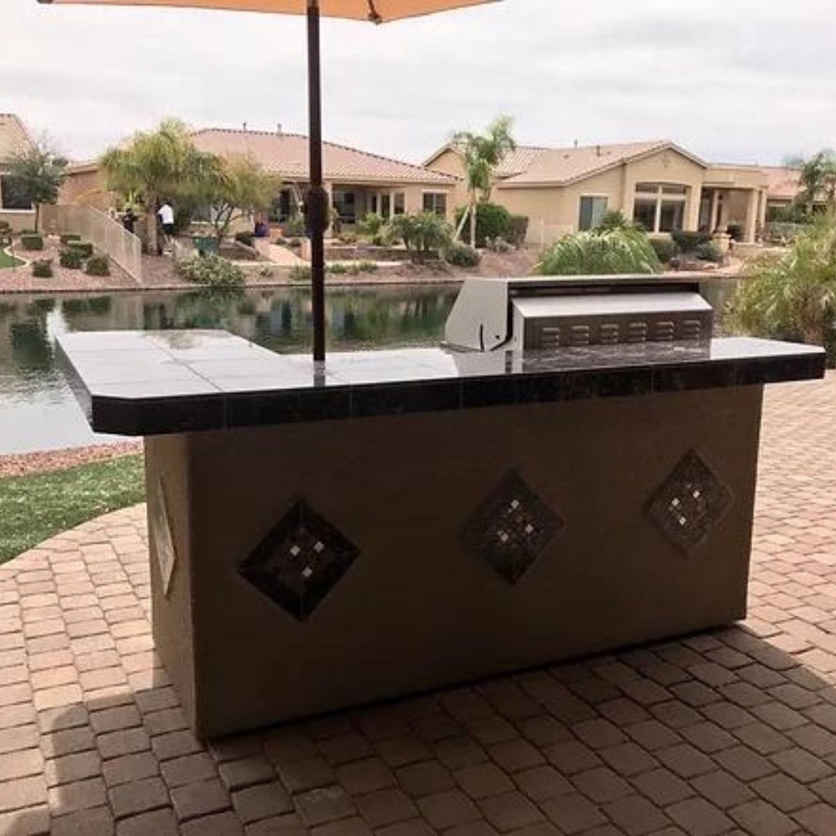 This is the finest Kokomo St. John 7'6" BBQ Island W High Bar on three sides and Lights 4 Burner BBQ Grill.